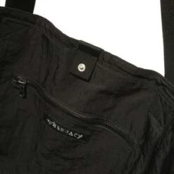 Our LegacyFLIGHT TOTE - BLACK DENSE LIQUID NYLON -AGOLDE Shop FLIGHT TOTE BLACK DENSE LIQUID NYLON 20230922043832 1