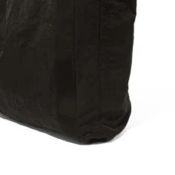 Our LegacyFLIGHT TOTE - BLACK DENSE LIQUID NYLON -AGOLDE Shop FLIGHT TOTE BLACK DENSE LIQUID NYLON 20230922043832 2